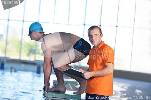 Image of swimmer practice jump with trainer