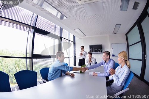 Image of business people making deal