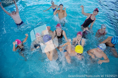 Image of happy children group  at swimming pool
