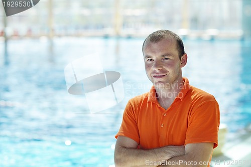 Image of happy children group  at swimming pool
