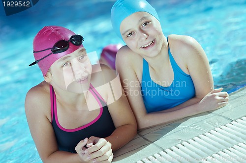 Image of happy children group  at swimming pool