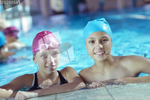 Image of happy children group  at swimming pool