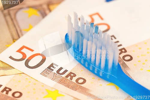 Image of Euro and tooth brush