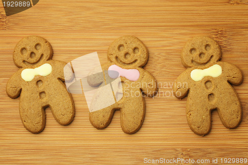 Image of Gingerbread man cookie on wooden background