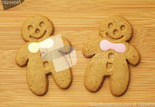 Image of gingerbread man over wooden background