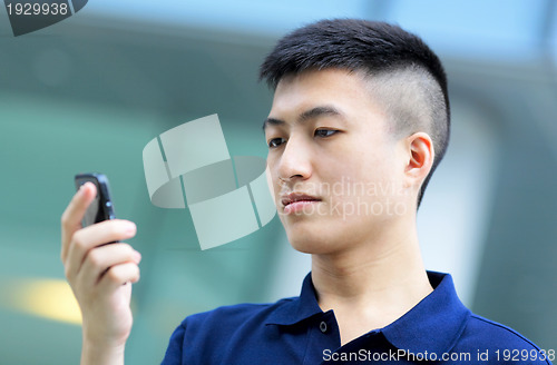 Image of Man send message on phone