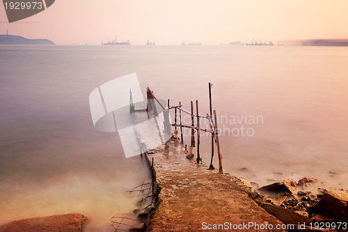 Image of pier with sunset