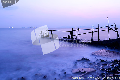Image of pier with sunset