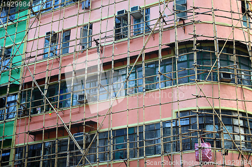 Image of bamboo scaffolding of repairing old building 