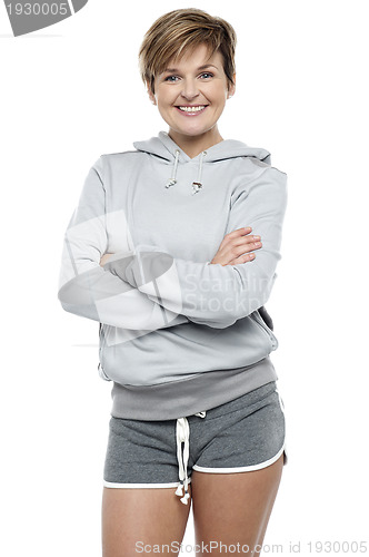 Image of Attractive lady wearing winter sweater and shorts