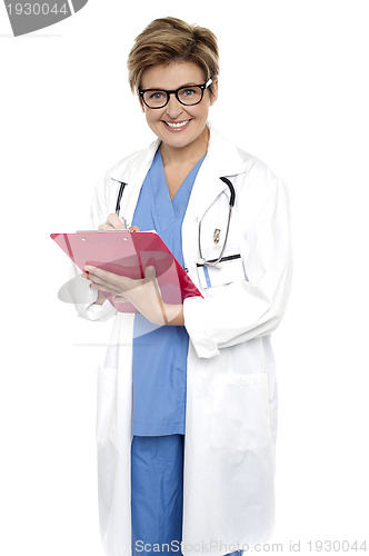 Image of Female doctor with a case file in her hand