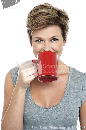 Image of Beautiful woman drinking coffee