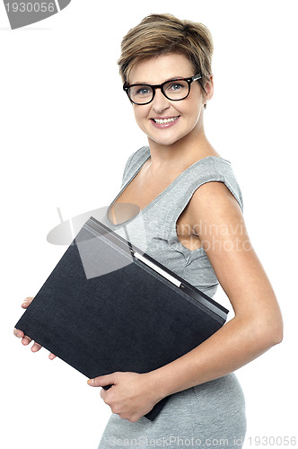 Image of Bespectacled gorgeous business lady at work