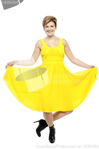 Image of Attractive smiling female in bright summer dress