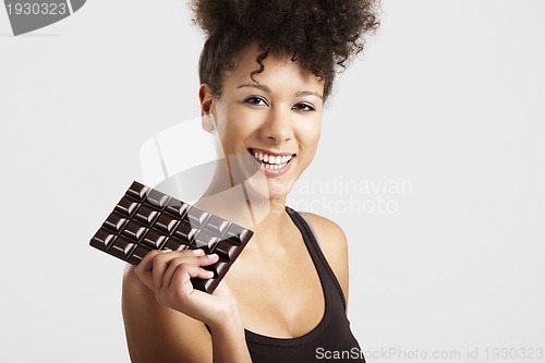 Image of Woman with a chocolate bar
