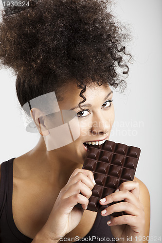 Image of Woman eating chcolate