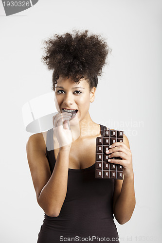 Image of Woman eating chcolate