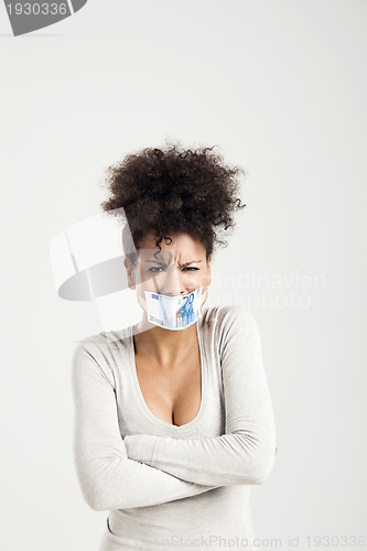 Image of Covering mouth with a euro banknote