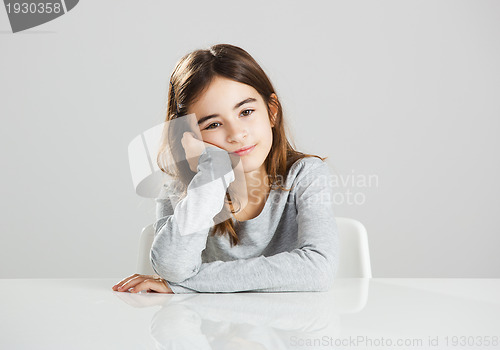 Image of Little girl in a desk