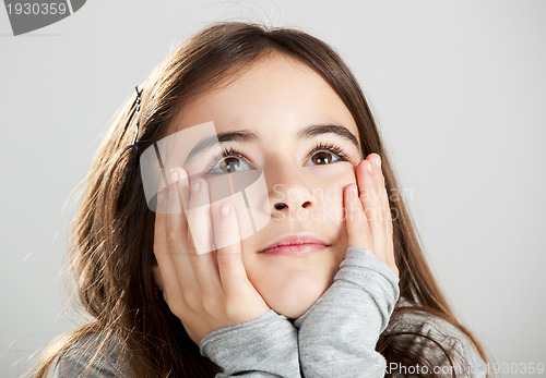 Image of Little girl thinking