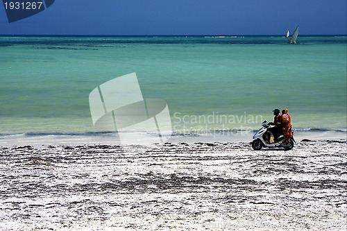 Image of scooter in the beach of zanzibar