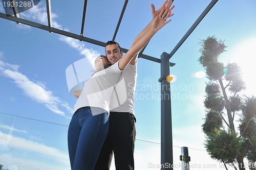 Image of couple relaxing on balcony