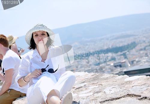 Image of Greek woman on the streets of Oia, Santorini, Greece