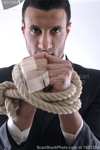 Image of business man with rope isolated on white background