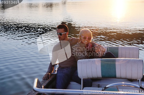 Image of couple in love  have romantic time on boat