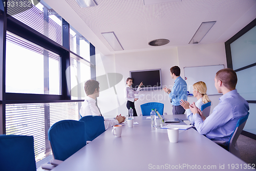 Image of business people in a meeting at office