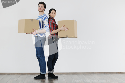 Image of Young couple moving in new house