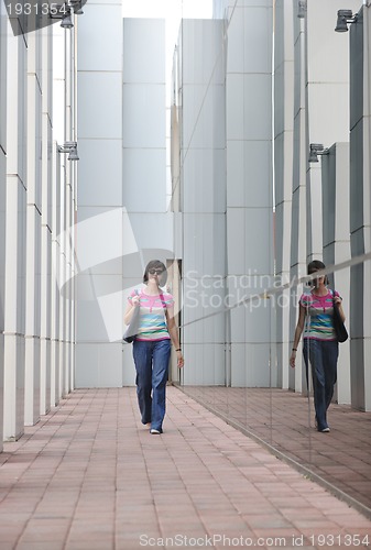 Image of beautiful young woman in the city