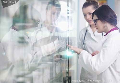 Image of team of pharmacist chemist woman  in pharmacy drugstore