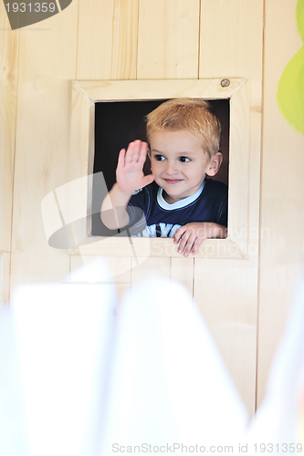Image of happy child in a window