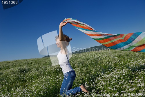 Image of young woman in wheat field at summer