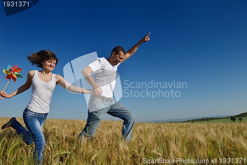 Image of happy couple in wheat field