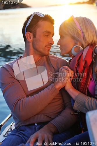 Image of couple in love  have romantic time on boat