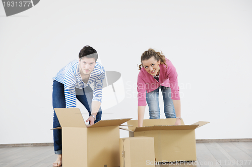 Image of Young couple moving in new home