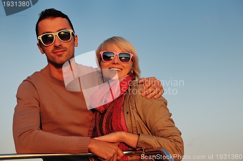 Image of couple in love  have romantic time on boat