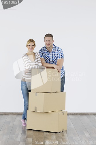 Image of Young couple moving in new home