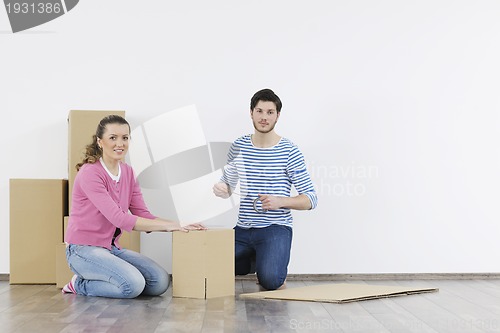 Image of Young couple moving in new home