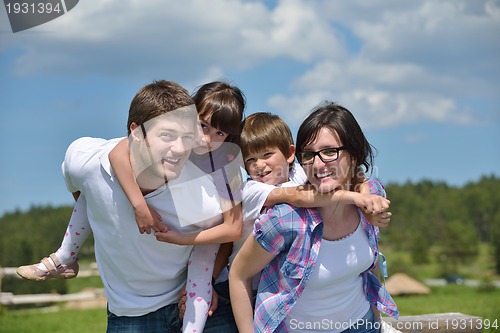 Image of happy young family have fun outdoors