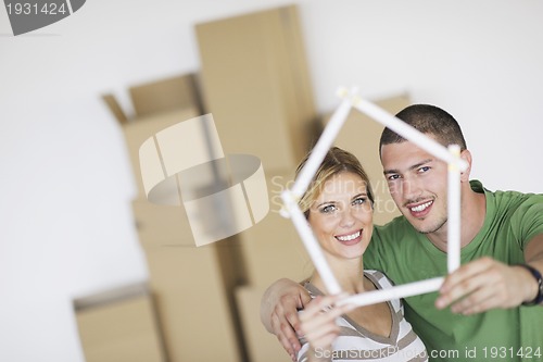 Image of Young couple moving in new home