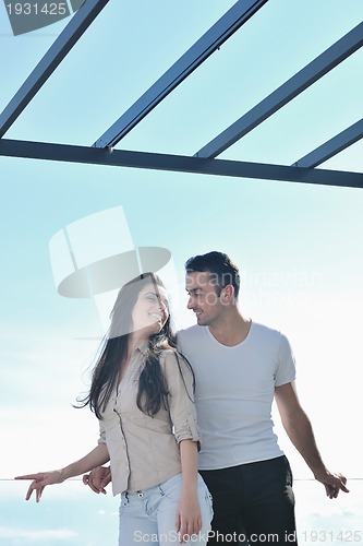 Image of couple relaxing on balcony
