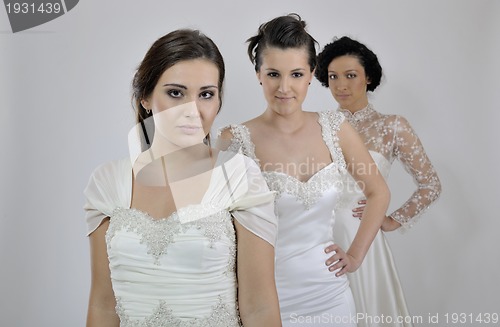 Image of portrait of a three beautiful woman in wedding dress