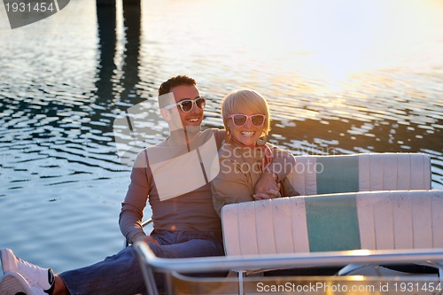 Image of couple in love  have romantic time on boat