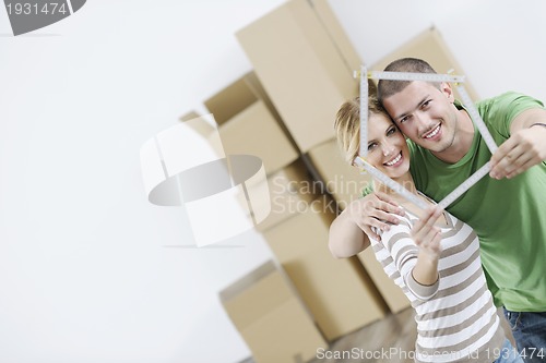 Image of Young couple moving in new home