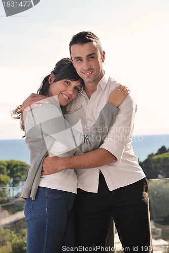 Image of couple relaxing on balcony