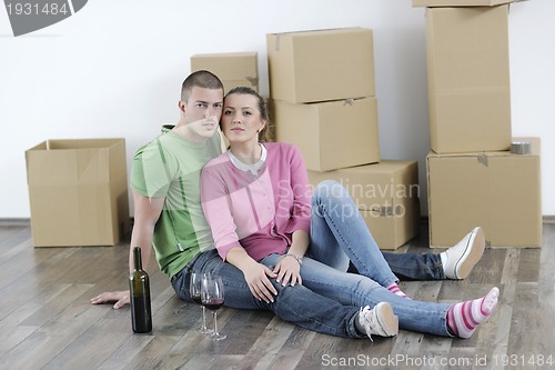 Image of Young couple moving in new home