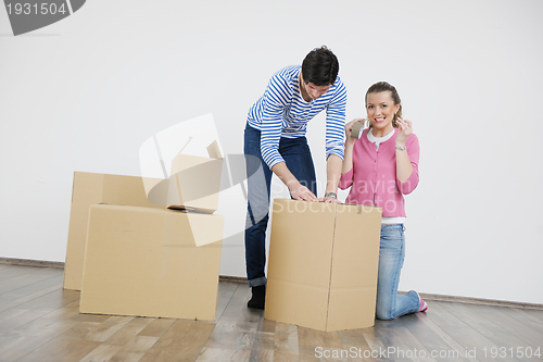 Image of Young couple moving in new house